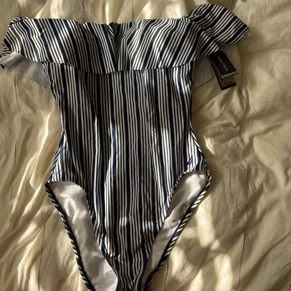 Brand new 1 piece bathing suit. Tags still on. Super cute